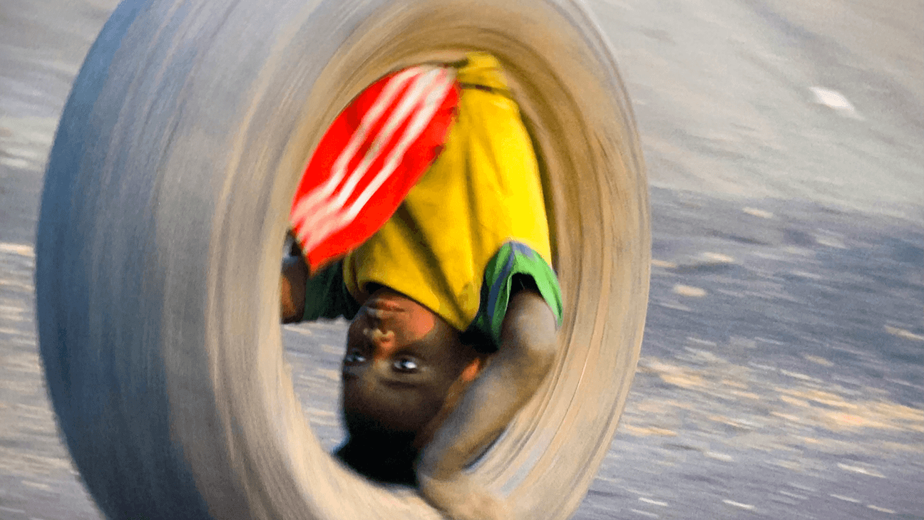 Children’s Game #29: La roue (film still). Lubumbashi, DR Congo, 2021